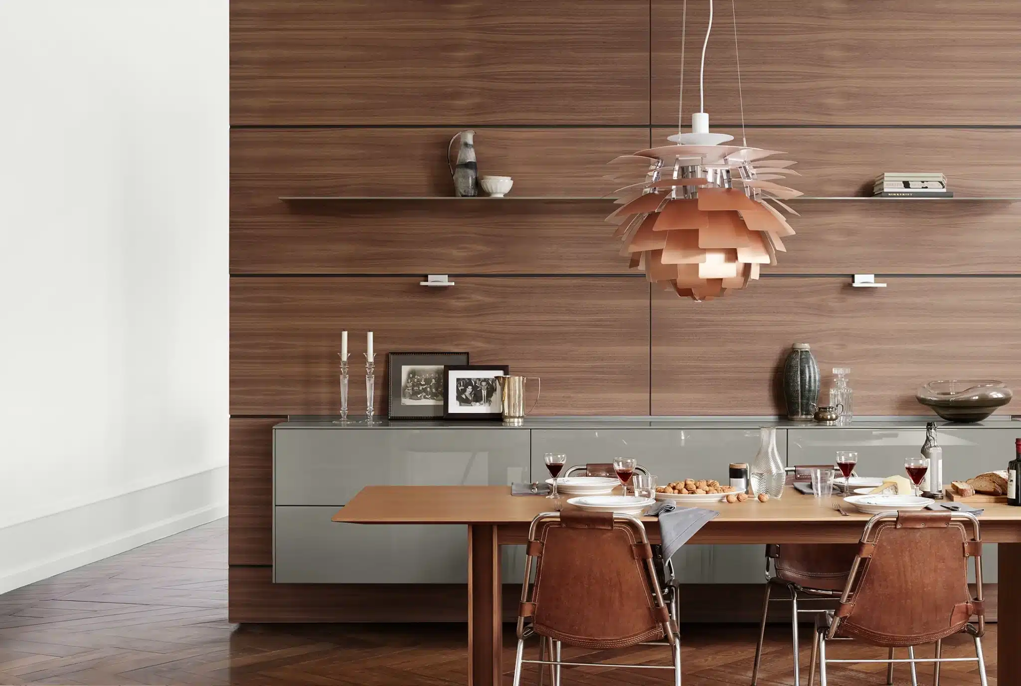 bulthaup B3 table with suspended wall section on walnut wall panels